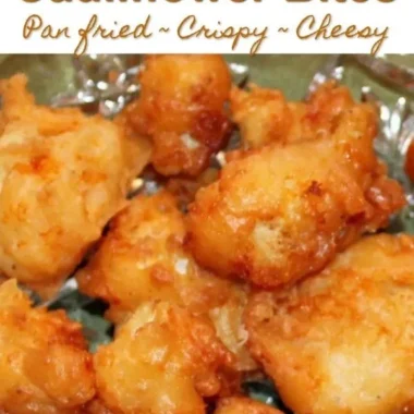 Cheddar fried cauliflower bites on a plate, golden and crispy.