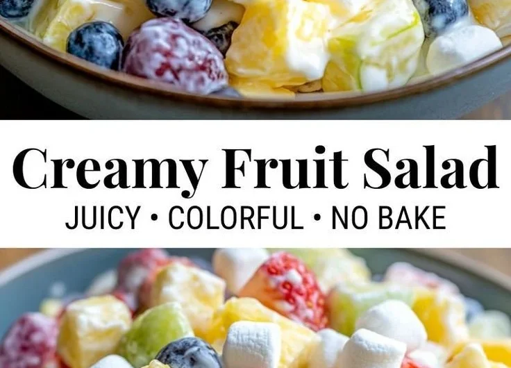 Bowl of creamy fruit salad with colorful fruits and a creamy dressing