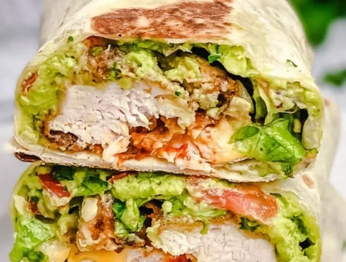 Crispy Chicken Wrap with fresh veggies and sauces served on a plate