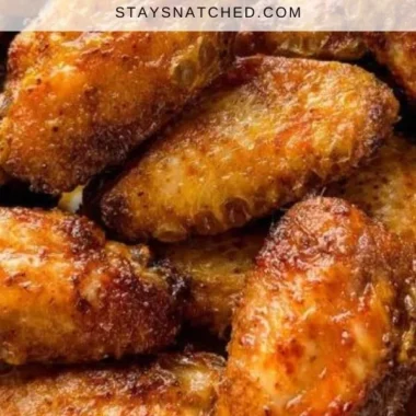 Delicious dry rub chicken wings served with dipping sauce on a platter.
