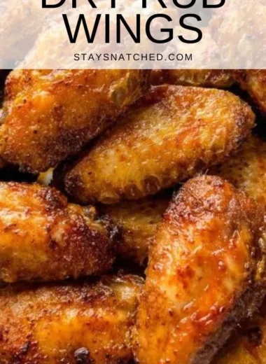 Delicious dry rub chicken wings served with dipping sauce on a platter.