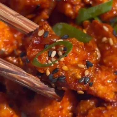 Delicious Gochujang Tofu served with vegetables and sesame seeds