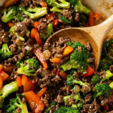 Dish of ground beef and broccoli served in a bowl with white rice