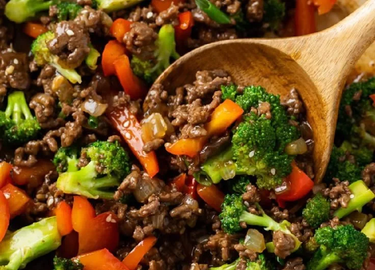 Dish of ground beef and broccoli served in a bowl with white rice