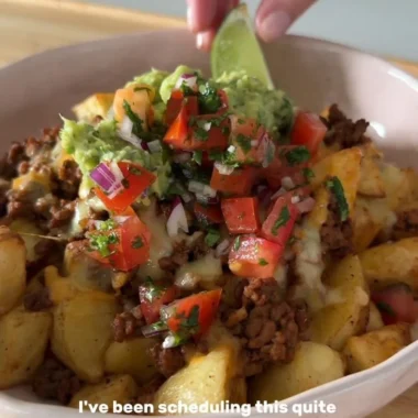 Delicious Loaded Potato Taco Bowl topped with fresh ingredients and sauces