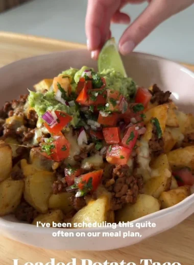 Delicious Loaded Potato Taco Bowl topped with fresh ingredients and sauces