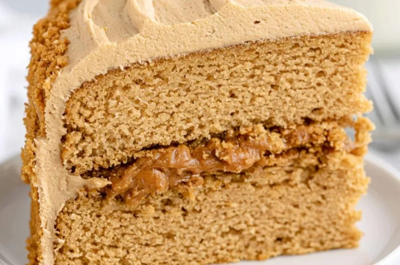 Delicious homemade Biscoff Cake topped with caramel and biscuit crumbs