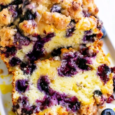 Freshly baked blueberry lemon loaf on a wooden table