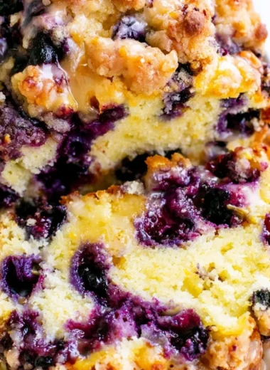 Freshly baked blueberry lemon loaf on a wooden table
