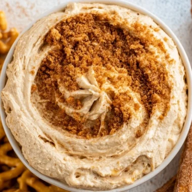 Delicious churro dip served in a bowl with churros for dipping.