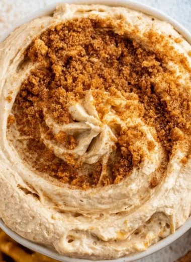 Delicious churro dip served in a bowl with churros for dipping.
