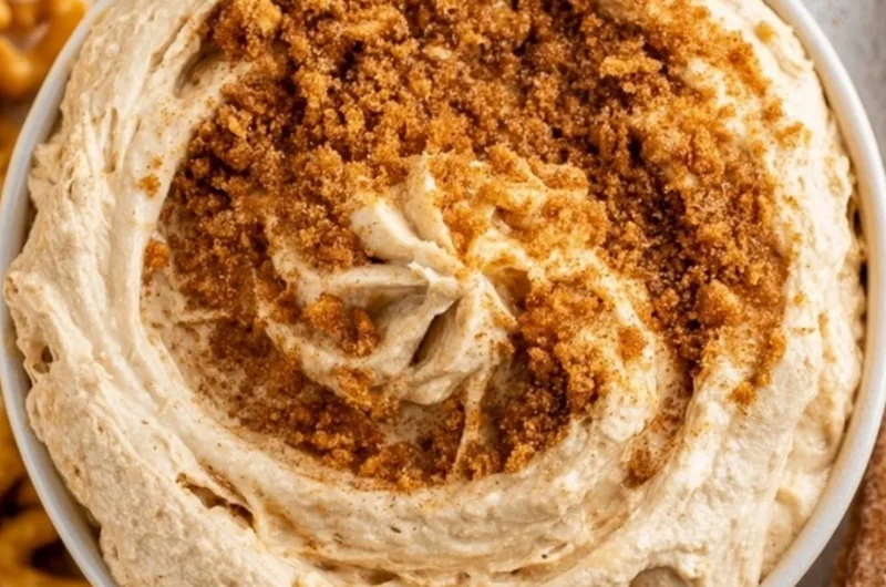 Delicious churro dip served in a bowl with churros for dipping.