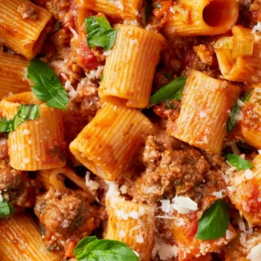 Delicious classic Bolognese sauce simmering in a pot with fresh ingredients.
