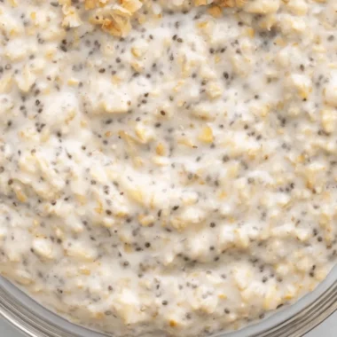Delicious coconut cream pie overnight oats topped with fresh fruit and chia seeds