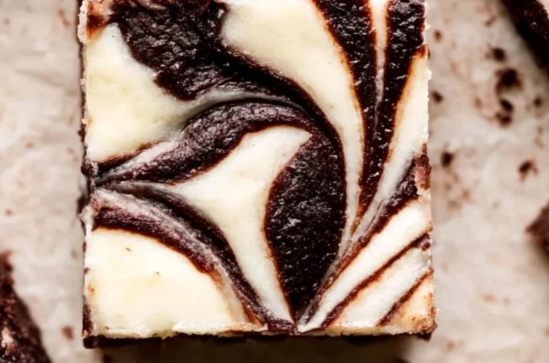 Delicious cheesecake marble brownies with swirls of cream cheese on top