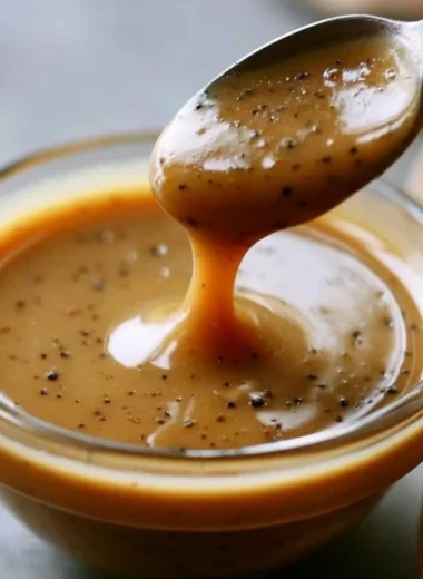 Creamy balsamic vinaigrette drizzled over a fresh salad