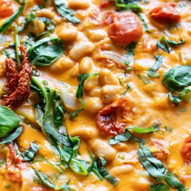 Creamy vegan tomato white bean stew served in a bowl