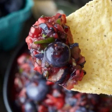 Fresh fruit blender blueberry salsa served in a bowl with colorful ingredients