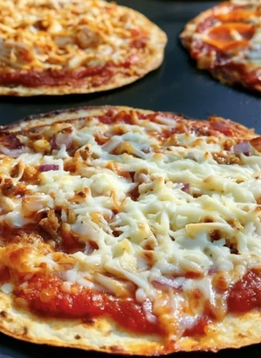 Delicious homemade Blackstone Griddle pizza cooking on a flat-top grill.