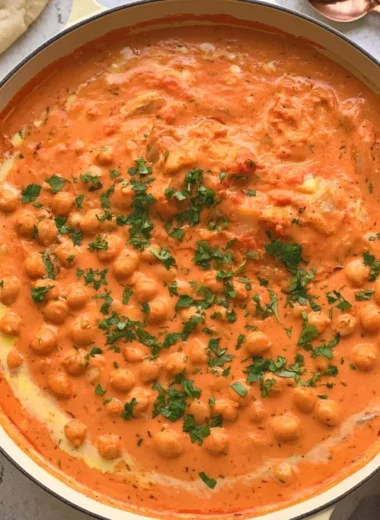 Delicious Indian Butter Chickpeas served with rice and garnished with cilantro