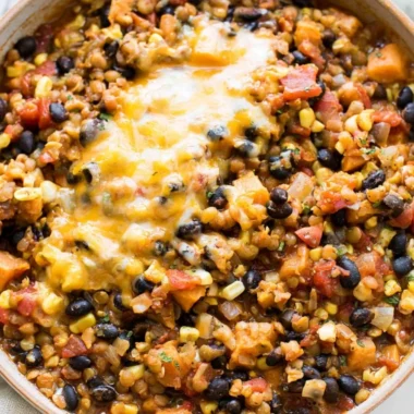 Delicious One Pot Mexican Lentils served in a bowl with colorful toppings.