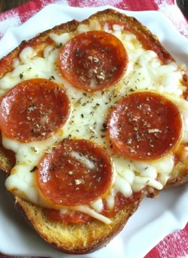 Garlic toast pizzas topped with cheese and fresh toppings for a quick meal
