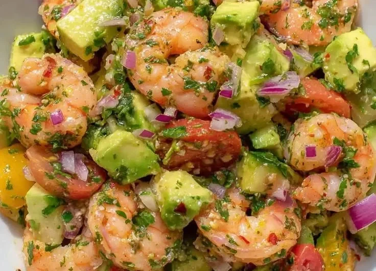 Delicious shrimp salad served in a bowl with fresh vegetables