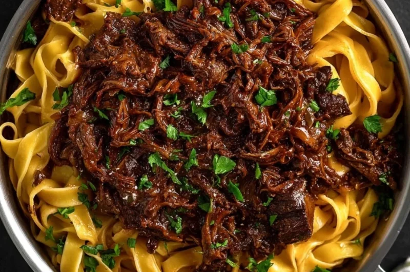 Delicious bowl of slow-cooked short rib ragù served over pasta.