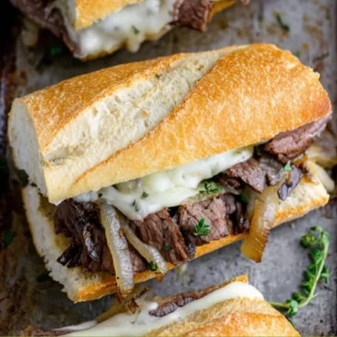 Delicious steak sandwiches with toppings and sauces ready to serve