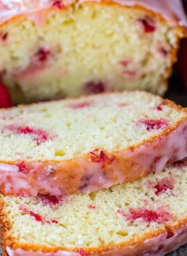 Homemade Strawberry Pound Cake with fresh strawberries and whipped cream