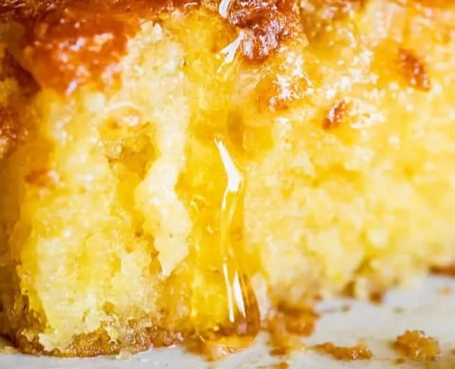 Sweet and moist honey cornbread served on a wooden table