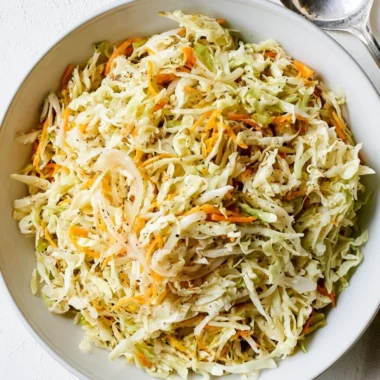 Bowl of refreshing vinegar coleslaw with vibrant vegetables