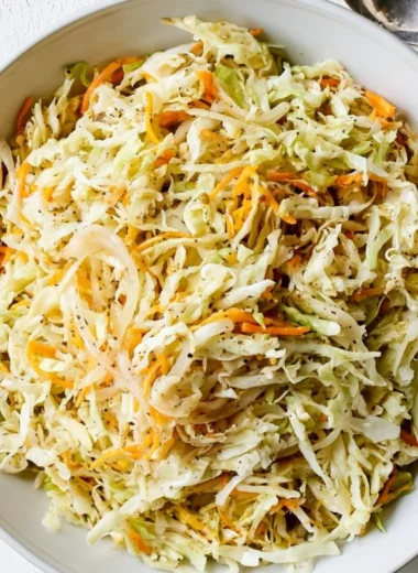 Bowl of refreshing vinegar coleslaw with vibrant vegetables