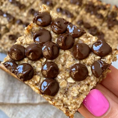 Delicious banana bread oatmeal bars topped with ripe bananas and oats