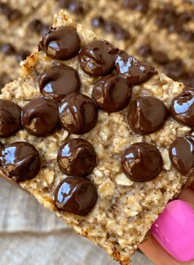 Delicious banana bread oatmeal bars topped with ripe bananas and oats