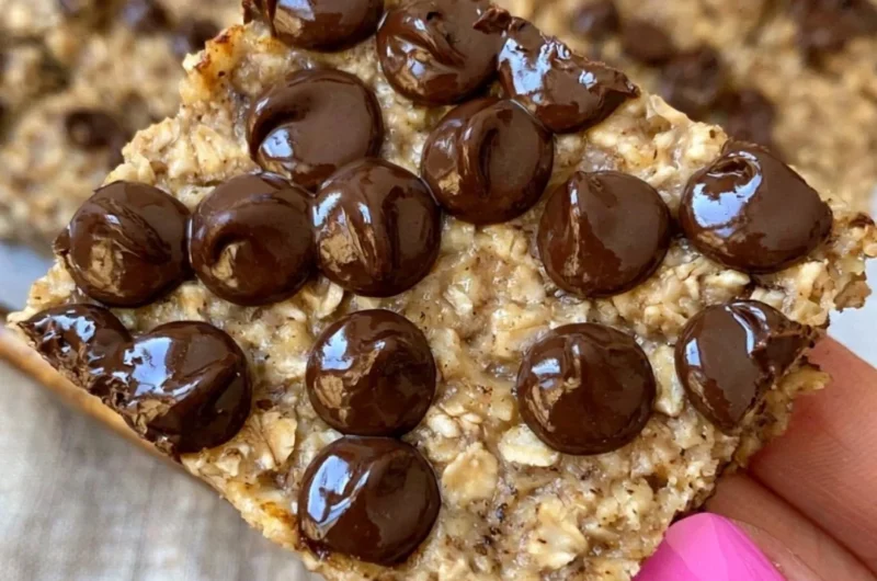 Delicious banana bread oatmeal bars topped with ripe bananas and oats