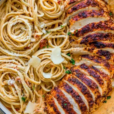 Plate of creamy Cajun chicken pasta garnished with herbs