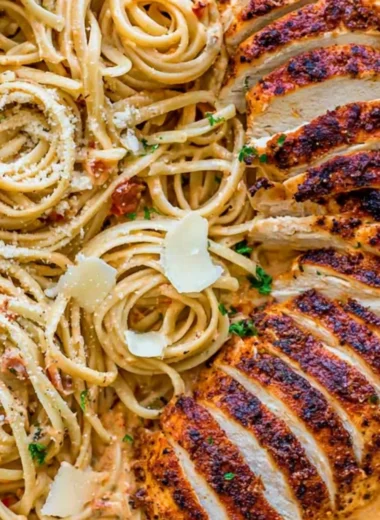 Plate of creamy Cajun chicken pasta garnished with herbs