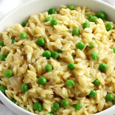Delicious creamy orzo dish topped with fresh herbs and cheese.