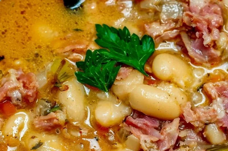 Crock Pot ham bone soup with beans in a bowl, perfect for warming up.