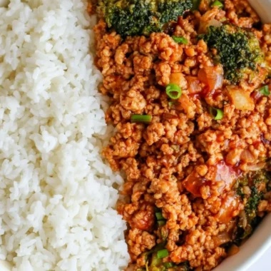 Spicy Firecracker Ground Chicken dish served in a bowl with garnishes.