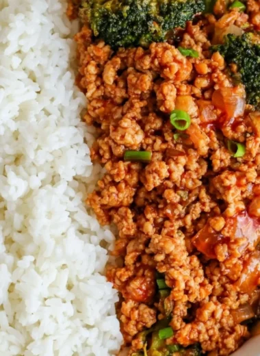 Spicy Firecracker Ground Chicken dish served in a bowl with garnishes.