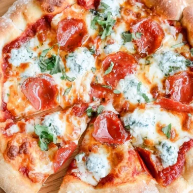 Delicious hot honey pizza topped with cheese and spicy drizzle