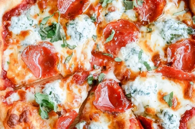 Delicious hot honey pizza topped with cheese and spicy drizzle