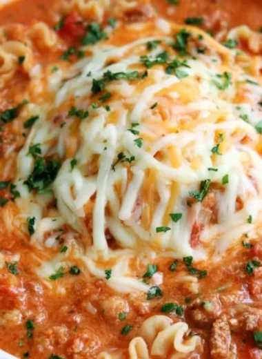 A delicious bowl of lasagna soup topped with cheese and herbs