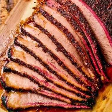 Delicious smoked brisket cooked on a pellet grill, showcasing BBQ perfection.
