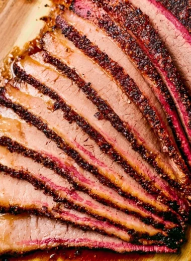 Delicious smoked brisket cooked on a pellet grill, showcasing BBQ perfection.