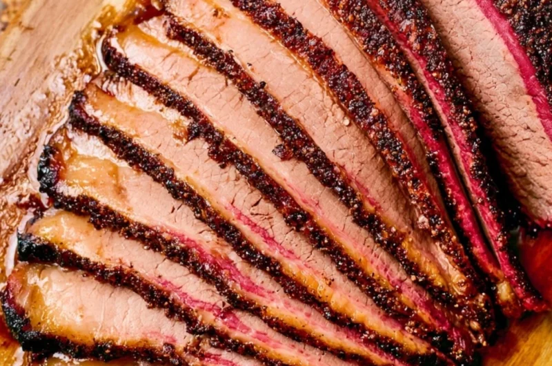 Delicious smoked brisket cooked on a pellet grill, showcasing BBQ perfection.