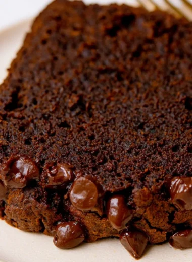 Sliced double chocolate pumpkin bread with chocolate chips on a plate
