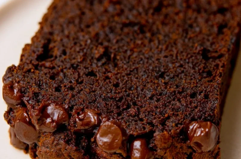 Sliced double chocolate pumpkin bread with chocolate chips on a plate